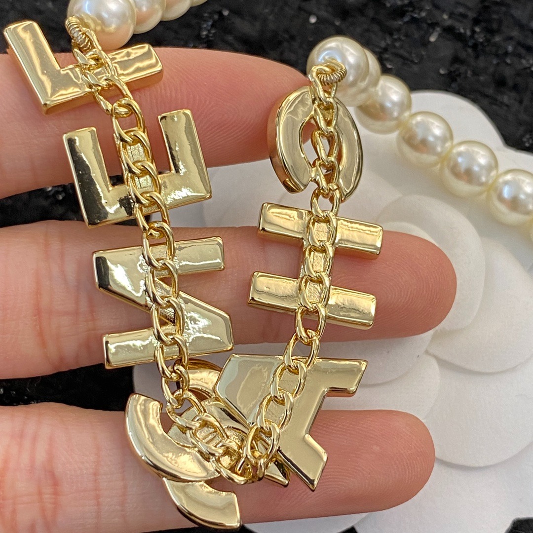 Ch**el Pearl And Crystal Logo Gold Tone For Women